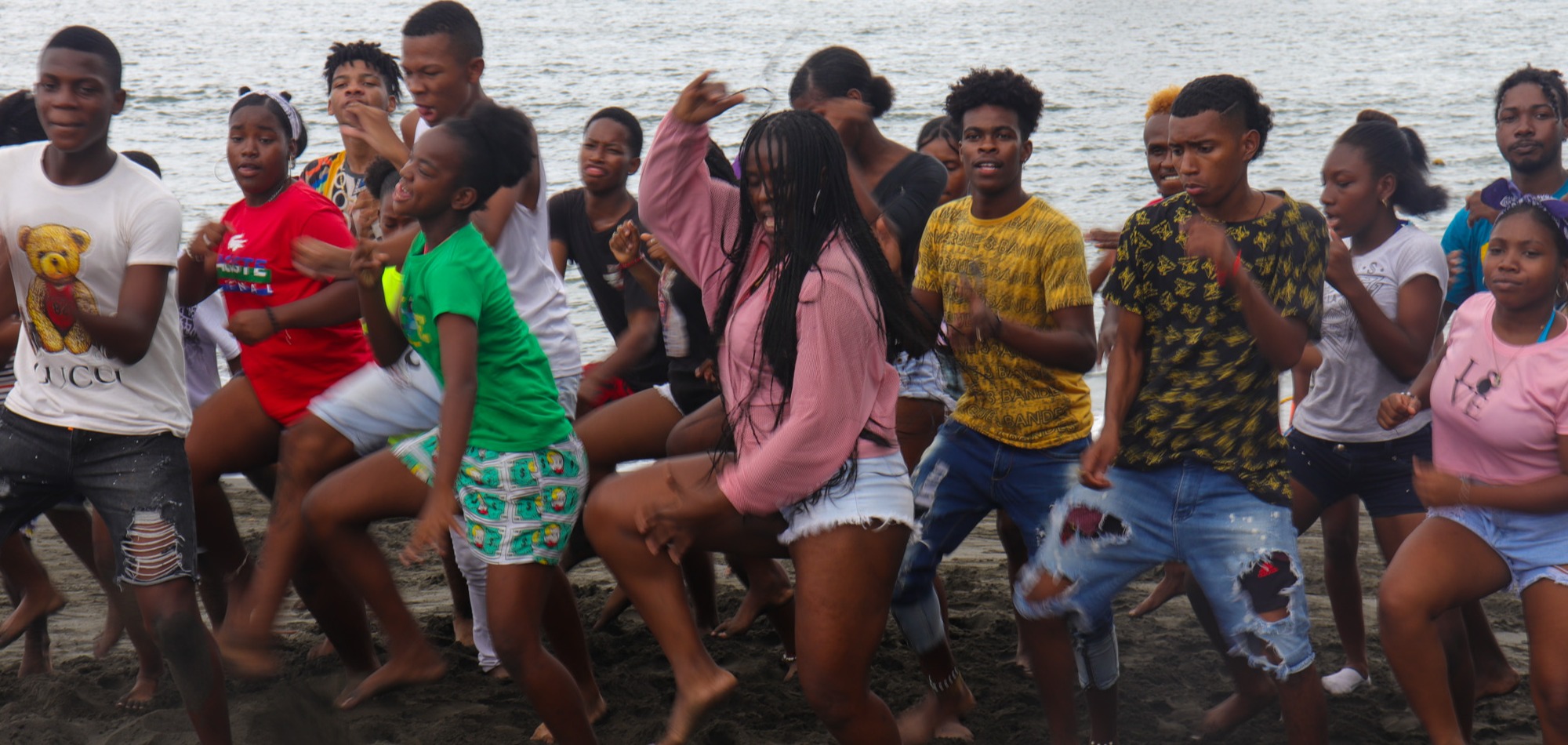 People dancing by the water