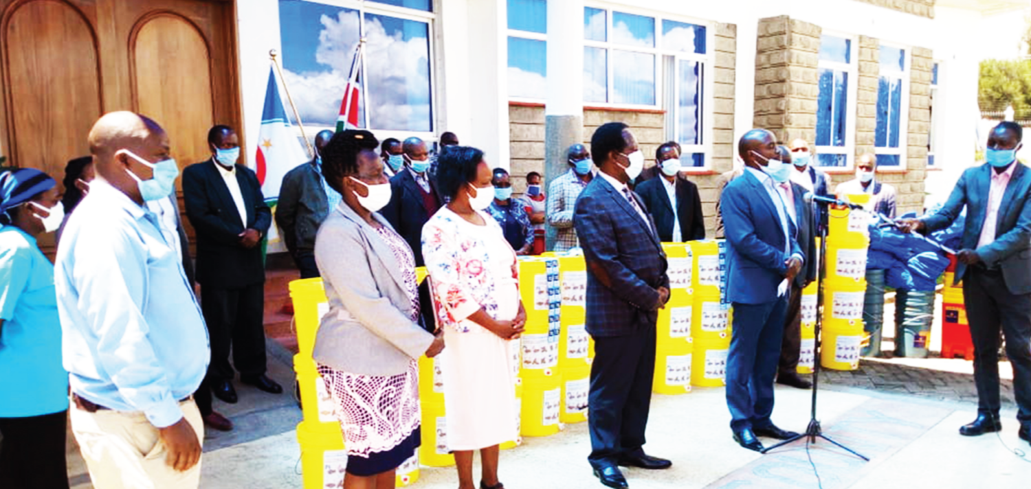 2-_Governor_of_Bomet_County_receiving_hand_washing_stations_from_Aqua_Clara
